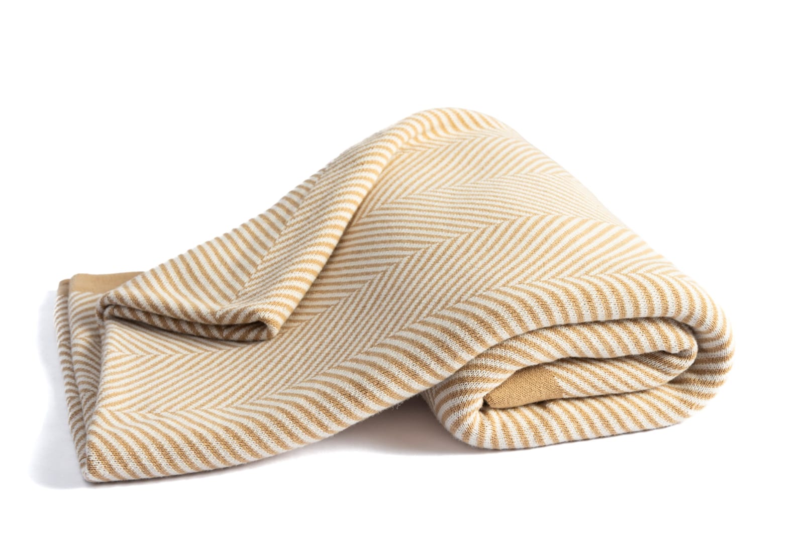 Folded cream herringbone-weave textile on a white background