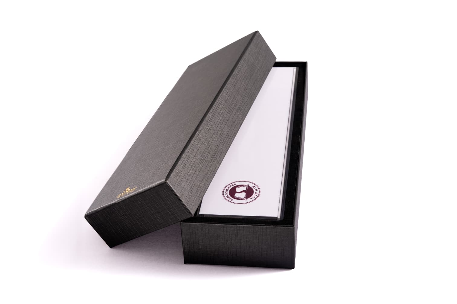 Open dark presentation box on white