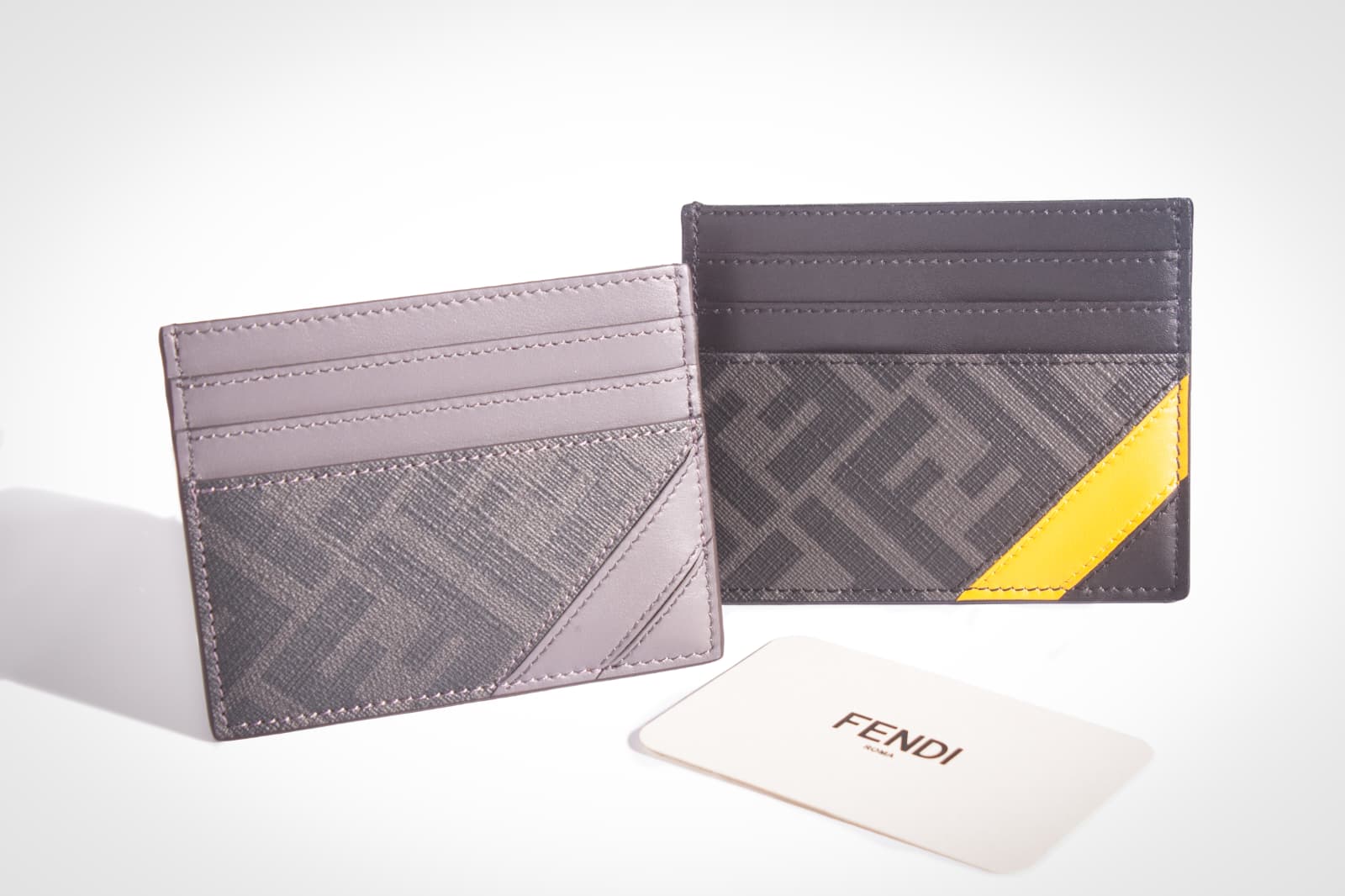 Two patterned card holders on a light background