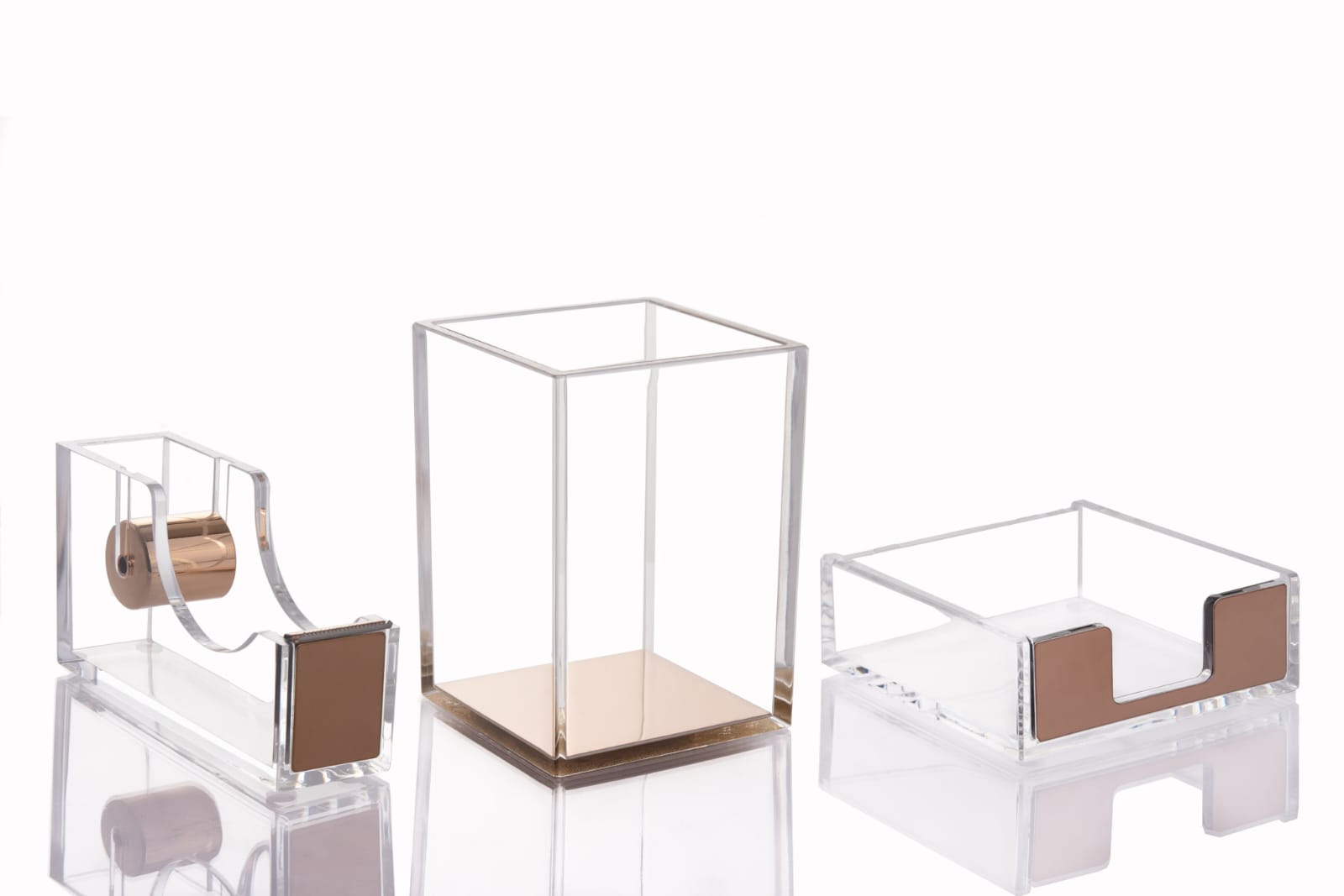 Clear acrylic desk accessories on white