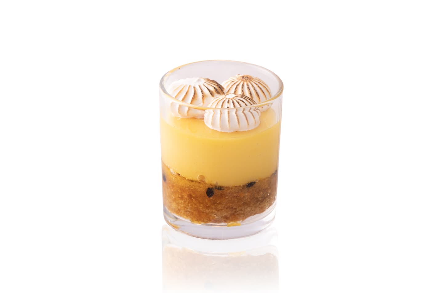 Layered yellow dessert in a clear glass